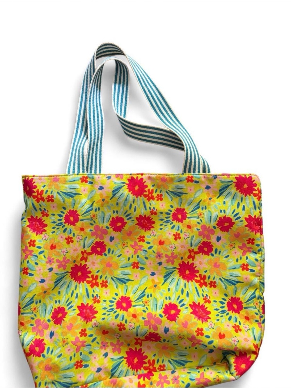 FLORAL all over print tote. Striped web handles.